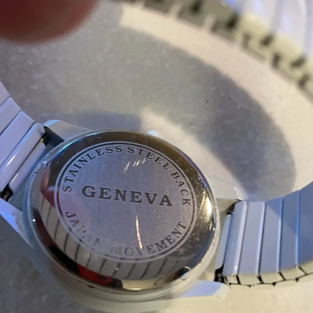 Geneva Ladies Analog Watch White Face Rhinestones White Metal Stretch Band